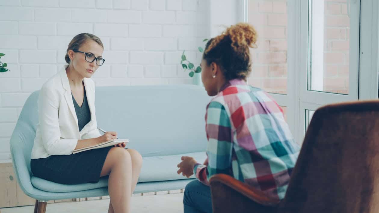 Brief coaching session — health professionals Two health professionals in a brief coaching session discussing a preferred future