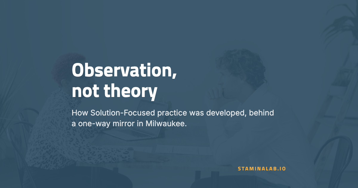 Observation, not theory Headline reading "Observation, not theory" over a navy-washed photograph of two people in a coaching session.
